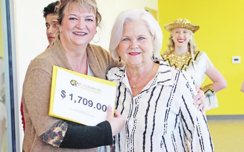 Angie Pope from MPHS receives a grant from Sandy Bible
