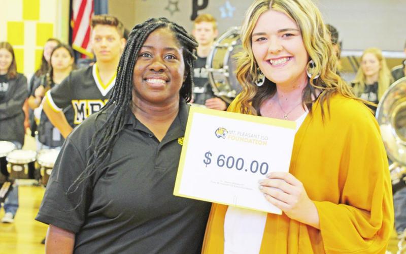 Jessica Williams from Corprew receives a grant from Crystal Jackson