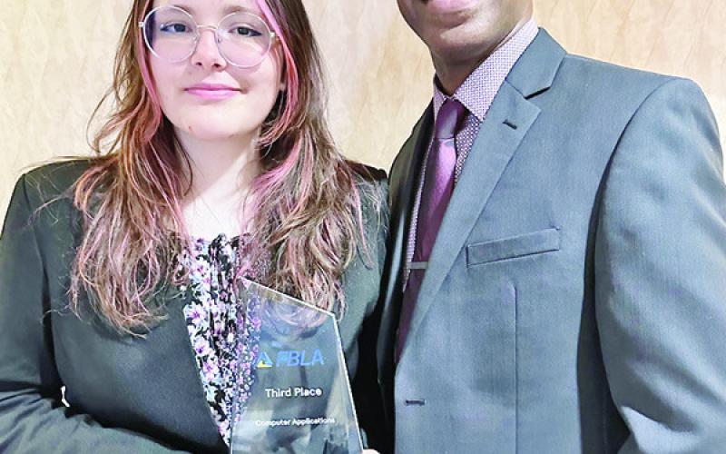 CHISD FLBA student Natalia Sekulic stands with advisor P. Anthony Williams. COURTESY PHOTO