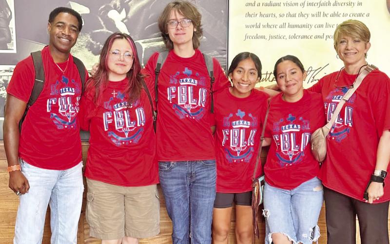The Chapel Hill FBLA team stands with advisors, P. Anthony Williams and Suzie Hall. COURTESY PHOTO