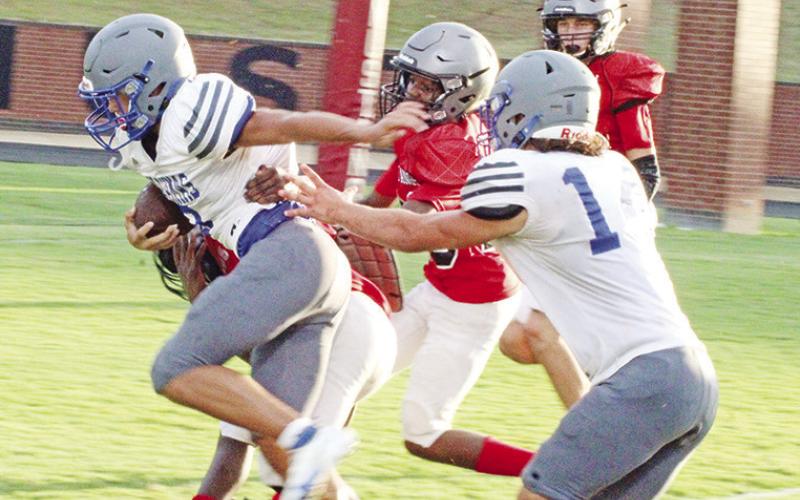 Pewitt’s Champ Bailey breaks away from the Hughes Springs defense during their scrimmage Thursday. The Brahmas open their season Friday at Winnsboro.
