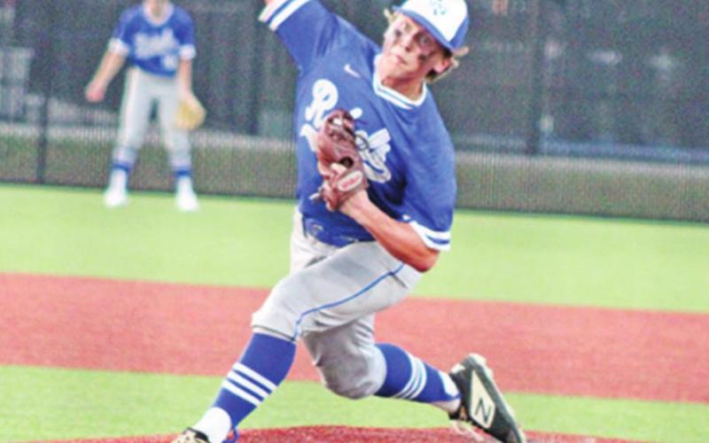 Connor Young fires off a pitch during game one of Rivercrest’s series against Kerens Thursday evening. Young allowed just four hits and striking out seven batters and added three hits, three stolen bases, an RBI and two runs scored offensively. TRIBUNE PHOTO / DI ANA FITZGERALD