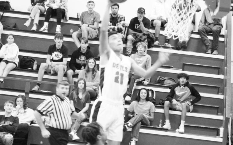 Red Devils defeat Trojans