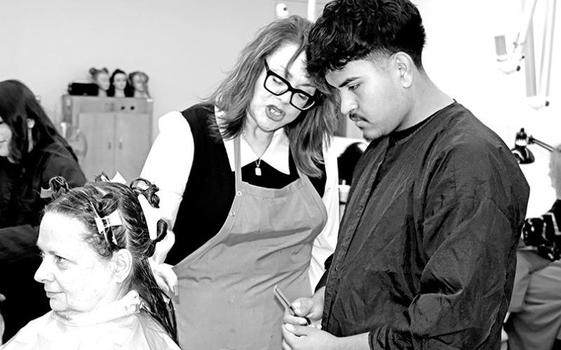 MPHS Cosmetology instructor Aleshia Rivera advises senior Osiel Andrade