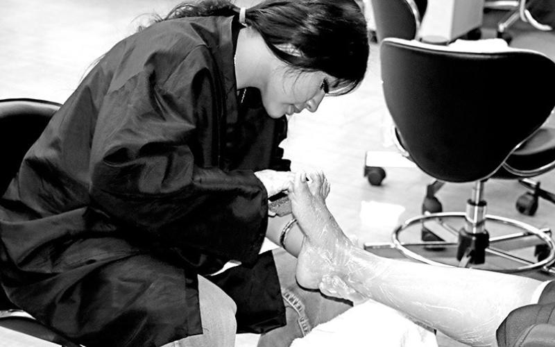 Junior Mia Jaime provides a pedicure for a client Courtesy Photos