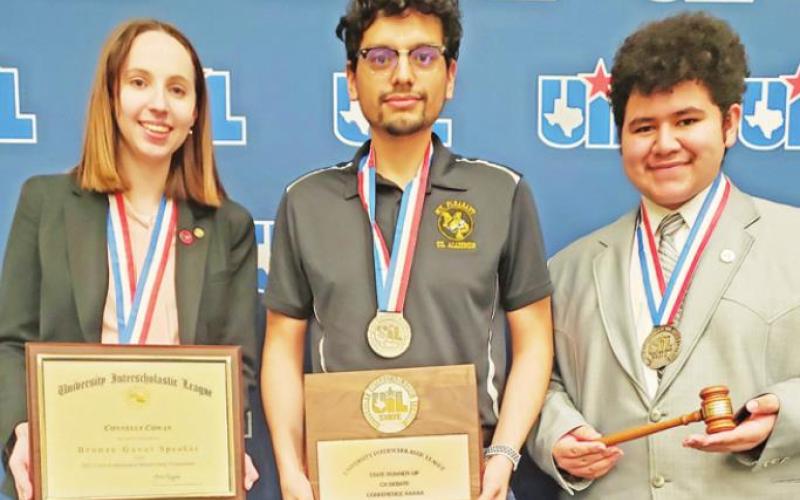 L to R: Connelly Cowan, Coach Enrique Martinez, and Anthony Orellana with their speaker awards and UIL State silver medals COURTESY PHOTO
