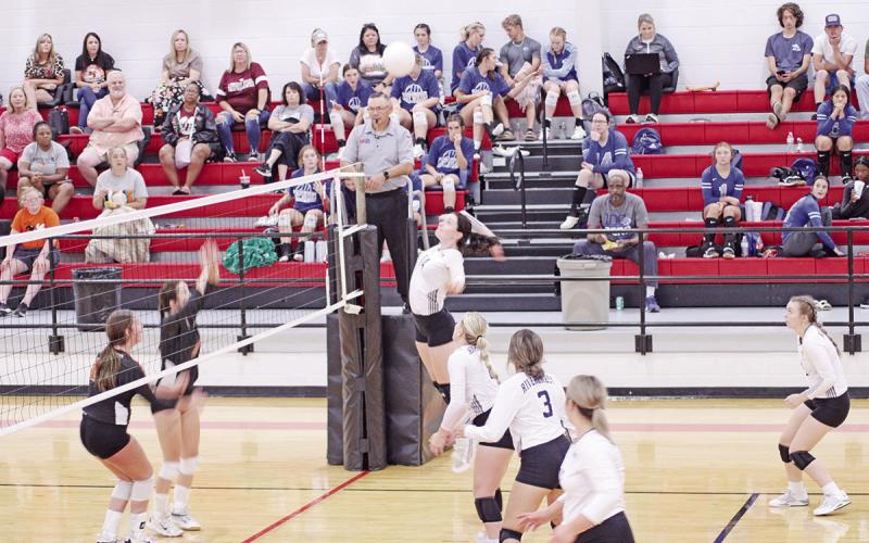 TRIBUNE PHOTO / QUINTEN BOYD Kynzie Franks jumps for a spike during tournament play at Hughes Springs last weekend. The Lady Rebels will play in the Hooks Tournament and on the road at Queen City this weekend.
