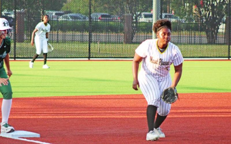 Mount Pleasant’s Amariya “B” Miller (front) and Paris Beard (back) prepare on defense as Huntsville’s Kali Klawinski stands on third base. TRIBUNE PHOTO / QUINTEN BOYD