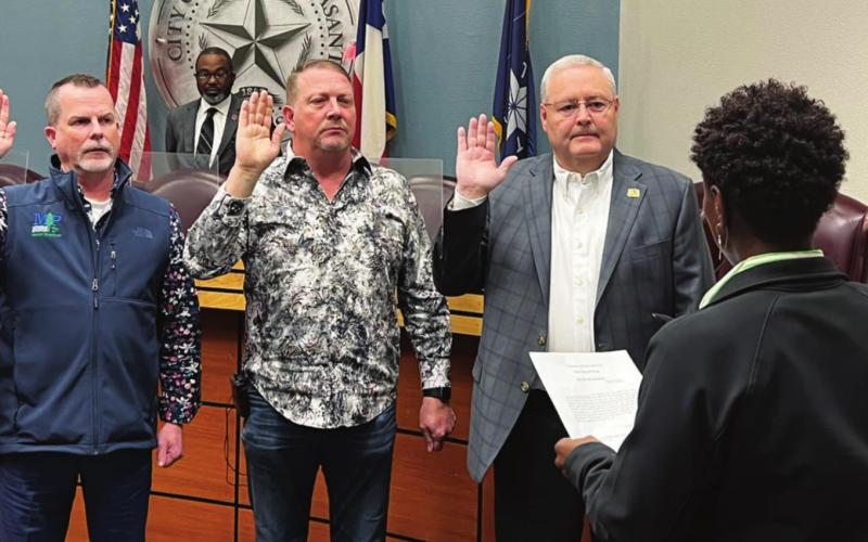 Councilmen Henry Chappell II (left), Galen Adams (middle), and Tim Dale (right) take the oath of office for their next term on the Mount Pleasant City Council. COURTESY PHOTO