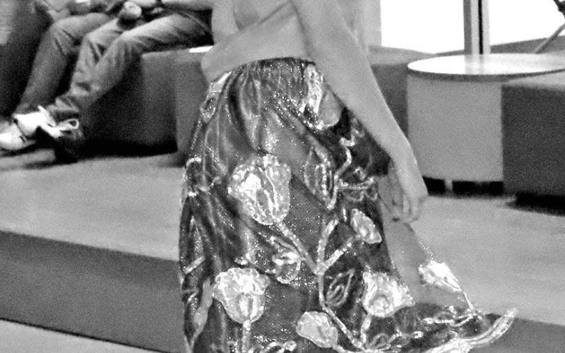 Lycen Logue twirls in a dress designed by Maleah Duenez COURTESY PHOTOS