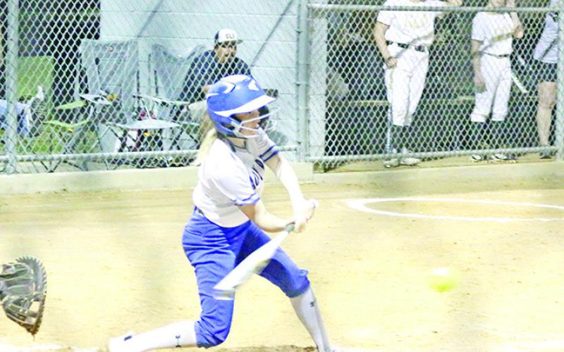 Rivercrest’s Abby Ross swings for what would be the game-winning hit Tuesday during the Lady Rebels’ game against Pittsburg. Ross hit the game-winning three RBI triple as the Lady Rebels won over the Lady Pirates in extra innings, 5-3. TRIBUNE PHOTO / QUINTEN BOYD