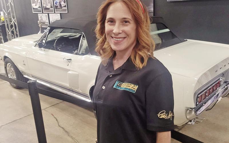 Former Shelby student Beth VanDyke pictured in Vegas with the car she helped restore during her internship with Legendary COURTESY PHOTO