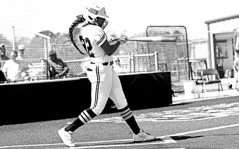 Azlyn Fluellen drives the ball up the middle for a double vs. Texas High.