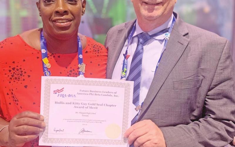 MPHS FBLA Advisors Shanta Lockett and John Whitten with the MPHS Gold Seal Chapter Award of Merit