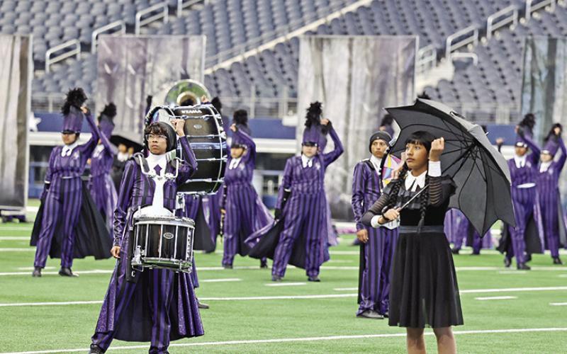 The Goin’ Gold Band starts their show, Wednesday, with the famous snaps from The Addams Family theme song