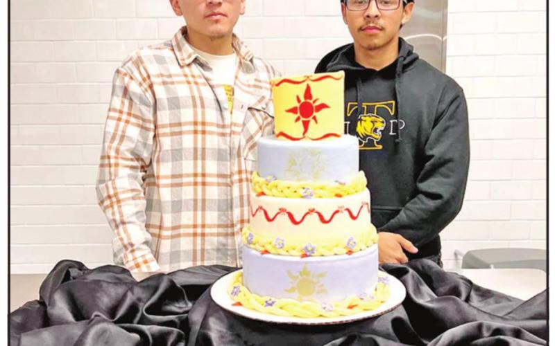 L to R: David Chavez and Axel Resendiz with their “Tangled” themed cake.