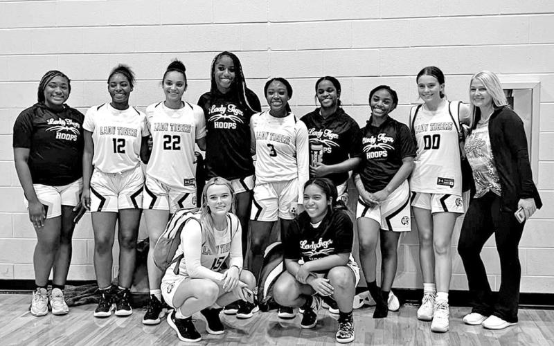 Lady Tigers roll to 8-0 start, Crandall Tournament title
