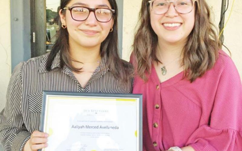Brenda Godoy (right), a previous NTCC Jack Kent Cooke transfer scholarship winner, presents a certificate to Aaliyah Avellaneda, who recently learned she is a winner of the same award. COURTESY PHOTO