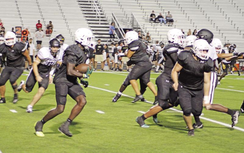Running back Braylon Jones and the Mount Pleasant Tigers will open their season Friday against the Pittsburg Pirates in the Black and Gold Classic. TRIBUNE PHOTO / QUINTEN BOYD