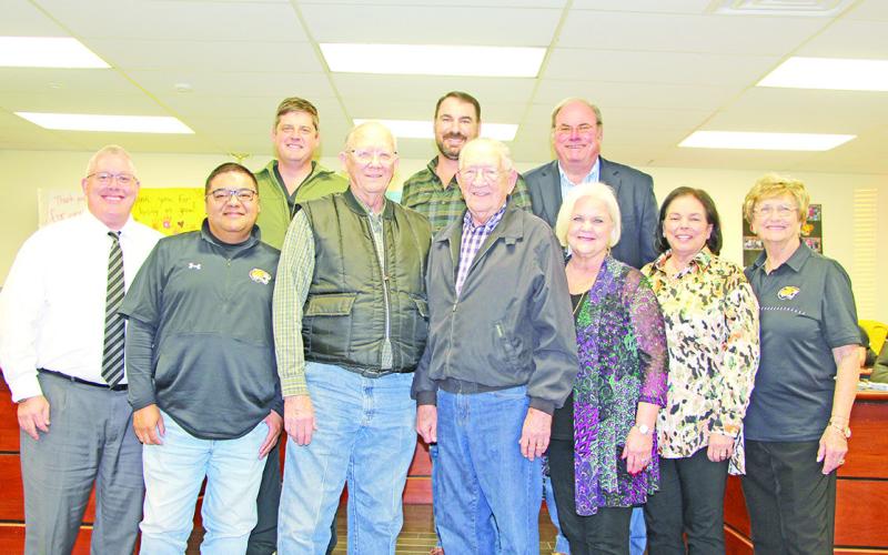 Board: The MPISD Board of Trustees with honored guests. Front row (L to R): MPISD Superintendent Judd Marshall, Juan Duenez, former board member Waylon Moore, former board member Jerry Smith, Sandy Bible, Kim Crabb. Back row (L to R): Dr. Kenny Thompson, Luke Anderson, Buddy Blue