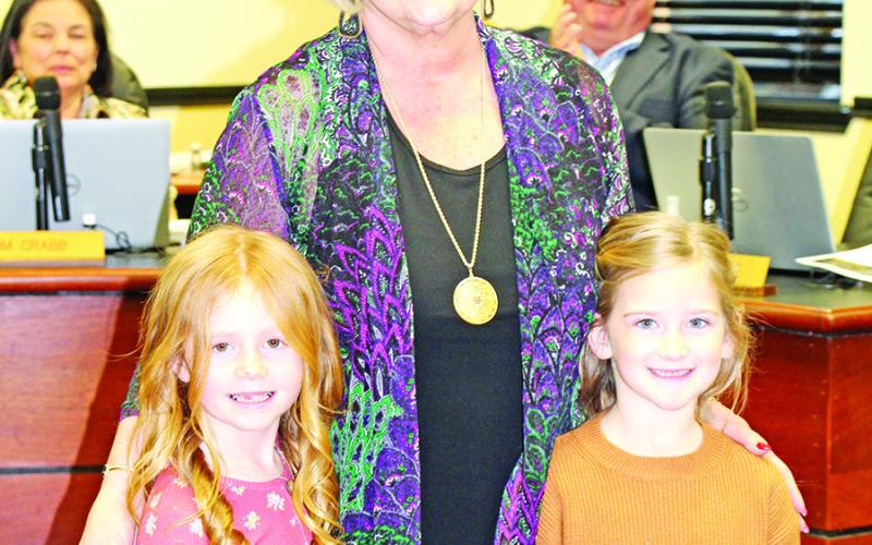 Rowan McCollum and Cora Smith from Brice Elementary honor Sandy Bible