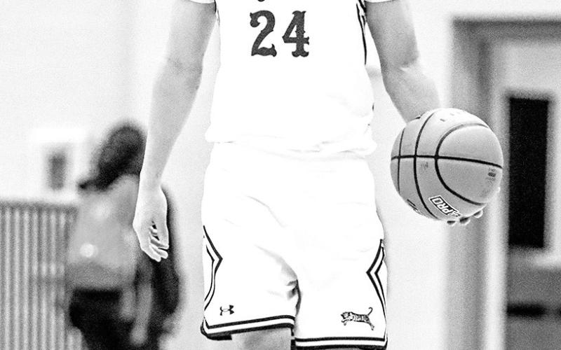 Carter Chisum led the Tigers against the Wildcats with 23 points.