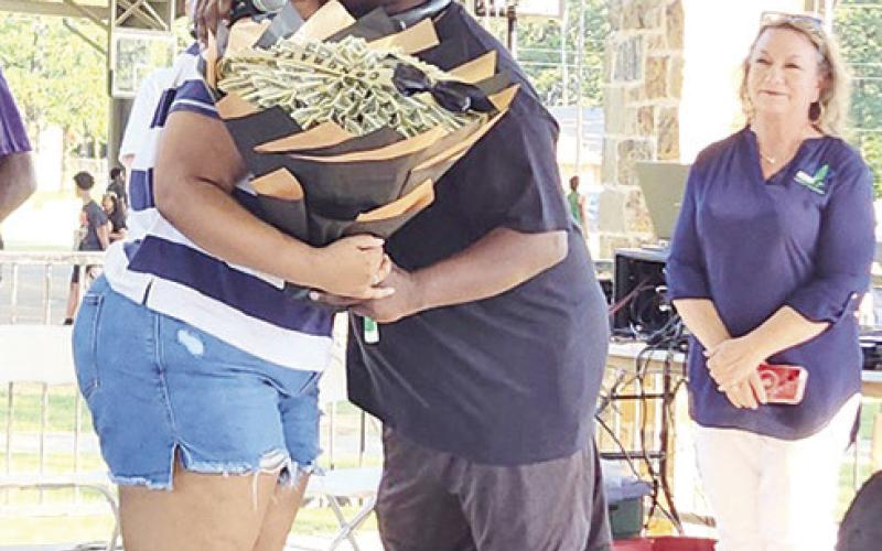 Kiera Rundles shares a hug with co-coordinator of the Juneteenth festival, Jerry Walker
