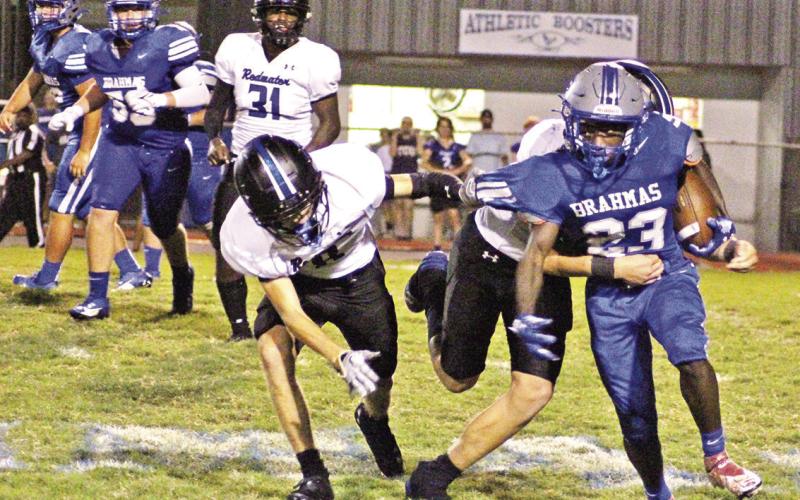 Pewitt’s Junie Johnson fights through tackles for a gain during Friday’s game against Redwater. The Brahmas will travel to DeKalb Friday evening. BEE PHOTO / QUINTEN BOYD