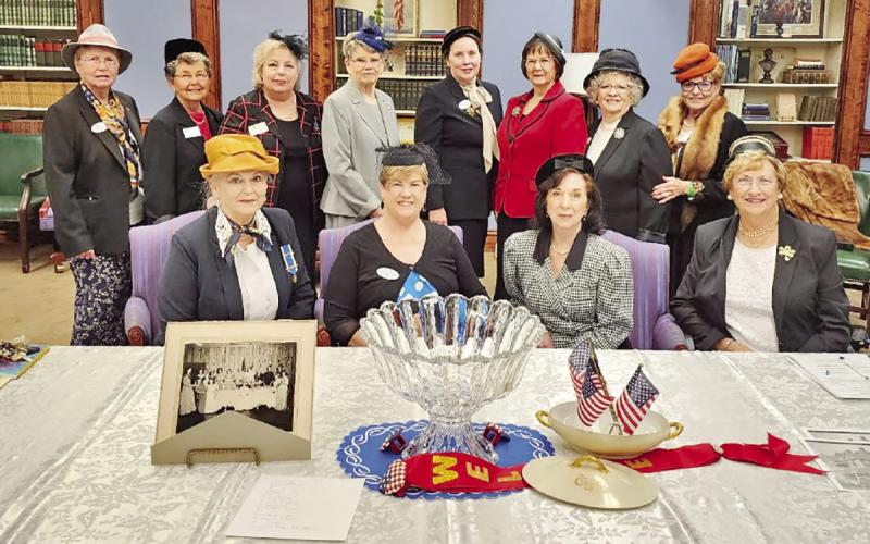 The Martha Laird Players, seated, left to right: Nancy Ryan, Beverly Sealy, Frances Beck, and Yvonne Hampton. Standing, left to right: Mavis Brush, Virginia Fortenberry, Tamara Moler, Linda Cady, Barbara Caldwell, Lani Hightower, Mary Jane Cannon, and Jean Hooker. The punch bowl belonged to founding member, Zenobia Lide and the china bowl and lid belonged to Bessie Caldwell. The photo on the table is from the Chapter’s 10th Anniversary Celebration.