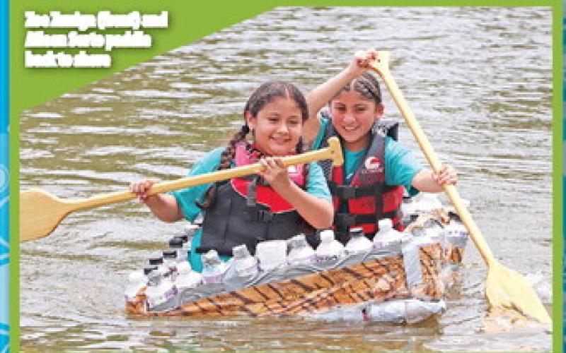 Zoe Zuniga (front) and Aileen Sorto paddle back to shore