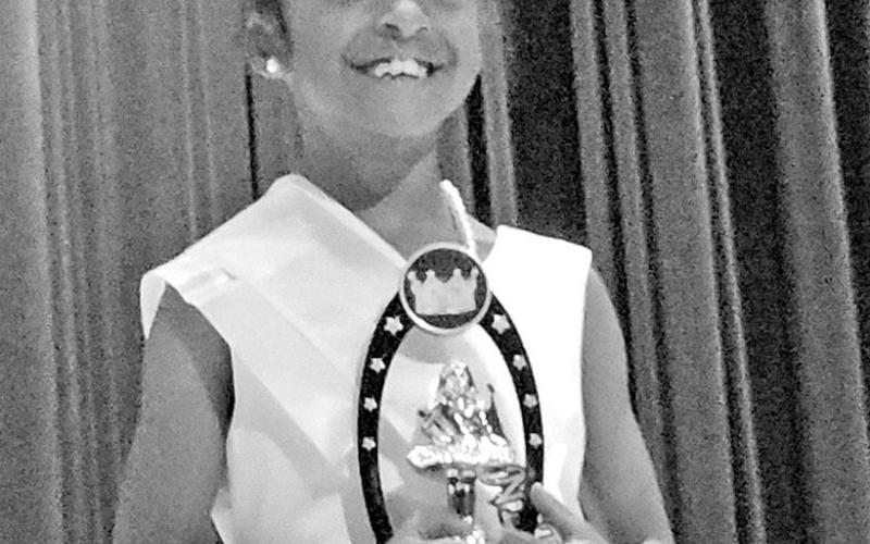 The newly-crowned Little Miss Juneteenth, Antonia Wooden, is all smiles