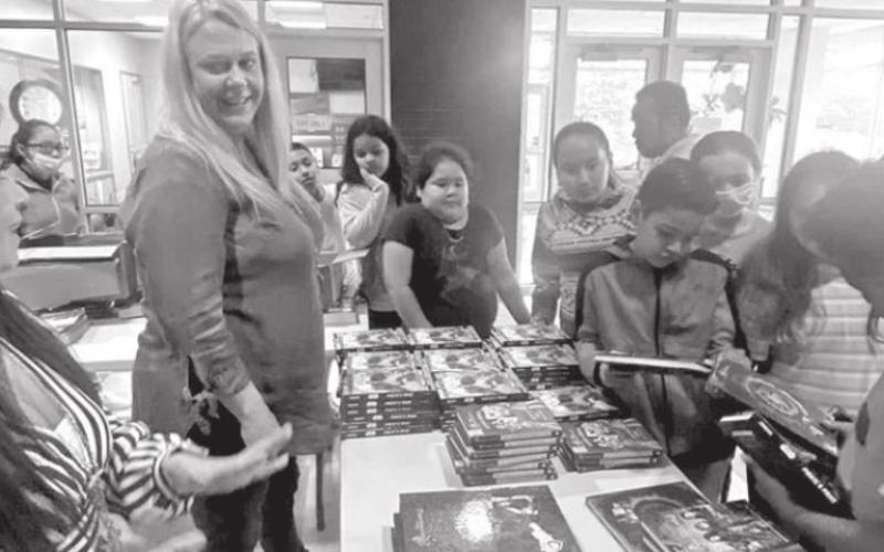 Titus County Cares distributes reading materials to area children