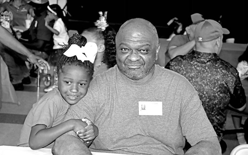 Alasia Canton enjoys spending time with her grandfather, Richard Canton, at Vivian Fowler Elementary.