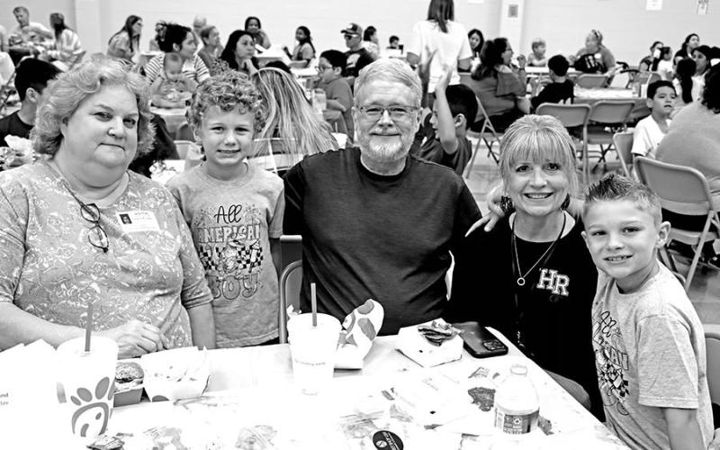 The Malone brothers, Tatum (second from left) and Beau (far right) ate a special lunch with their grandparents (L to R) Suzanne Knippers, Tony Malone, and Deb Malone. COURTESY PHOTOS