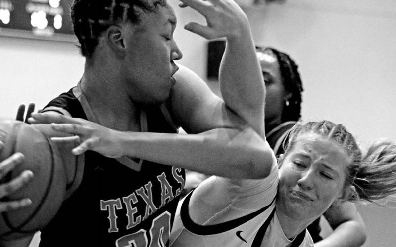 Fight For Ball Mount Pleasant’s Eva Hampton (5) fights for the ball during a recent home victory against Texas High. The Lady Tigers, who picked up a 71-40 win over Marshall last week to improve to 9-4 in District 10-5A, will travel to Lufkin on Friday and host Whitehouse on Tuesday.