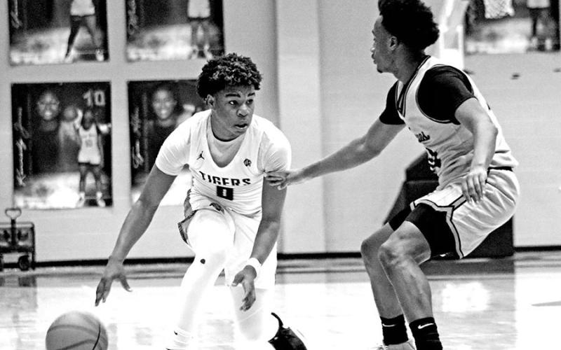 Pushing The Ball TRIBUNE PHOTOS / MICHAEL S. MCCRACKEN Mount Pleasant sophomore guard Zeke Hill (0) dribbles the ball during a recent home victory against Texas High. The Tigers defeated Marshall 66-44 last week to improve to 10-1 in District 10-5A and 21-4 overall. They will visit state-ranked Lufkin (28-2, 11-0) this Friday night.