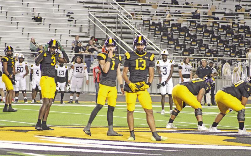 From left, Kevi Heath, Braylon Jones, Mason McMinn and Kyler Smith look to the sidelines to receive a play call during a recent game. Mount Pleasant will host Pine Tree Friday at Sam Parker Field, needing two wins to keep their playoff hopes alive. TRIBUNE PHOTO / QUINTEN BOYD