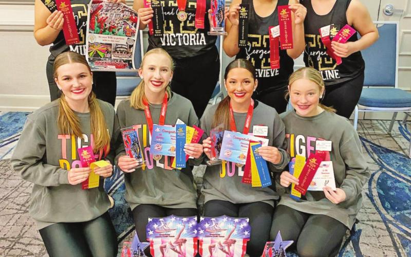 The 2021-2022 Tiger Doll Officers and Sergeants. Front Row L to R: Junior Lieutenant Anna Kate Fisher, Captain Mary Kait Heeren, 1st Lieutenant Grelyn Goolsby, and Junior Lieutenant Chloe Carter. Back Row L to R: Sergeant Mireya Villarruel, Head Sergeant Victoria Hernandez, Sergeant Genevieve Rubio, and Sergeant Madeline Plascencia COURTESY PHOTO