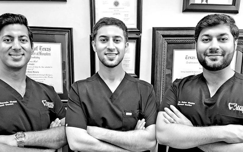 Dr. Husban Shahid (middle) joins his brothers at Pleasant Smiles Dental