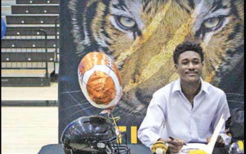 COURTESY PHOTO Months after suffering an injury during Mount Pleasant’s game against Frisco Emerson, Tiger Isaiah Hunter signed his letter of intent to play football at Texas College. The Steers are part of the Red River Athletic Conference of NAIA and finished last season 1-10.
