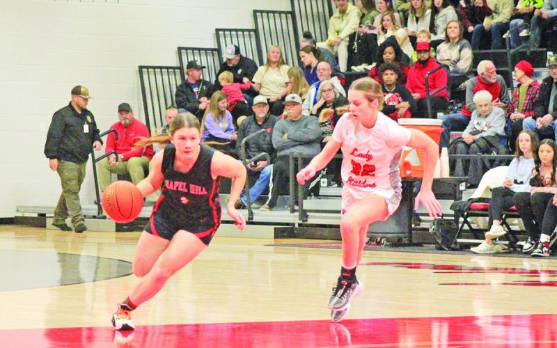 Kaylee Tompkins drives upcourt during Tuesday’s game at Winnsboro. The Lady Devils are 1-2 in their last three games, winning over Winona but falling to rivals Mount Vernon and Winnsboro.