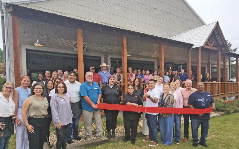 Rancho Seco Steakhouse snips the red ribbon, officially open on May 15