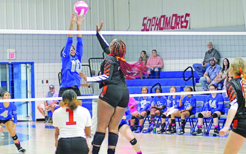 Pewitt’s Taliyah Brown jumps for a block during last Friday’s match against DeKalb. The Lady Brahmas traveled to New Boston Friday and will play at Hooks Tuesday. TRIBUNE PHOTO / QUINTEN BOYD