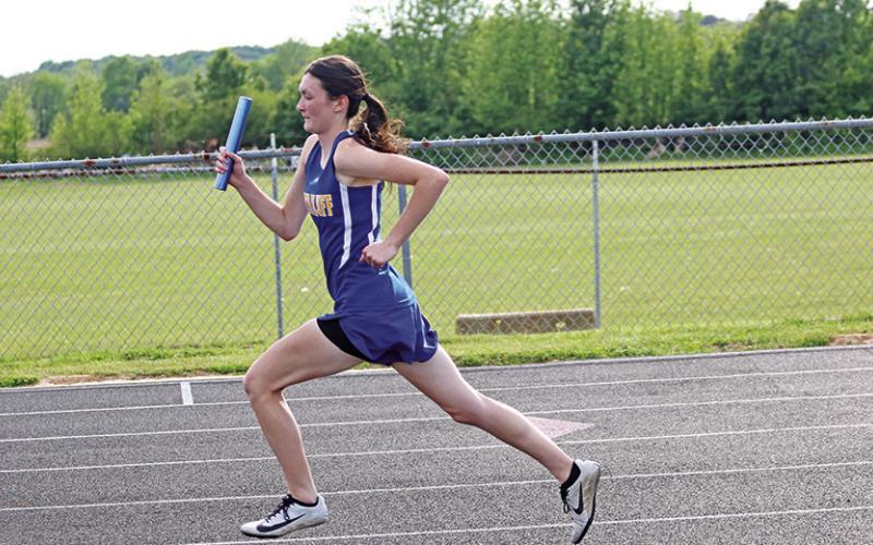 Harts Bluff’s Kaitley Green takes off during the varsity girls’ 4x400 meter relay. The Lady Bulldog team of Green, Estefania Valdez, Perla Solorio and Alexa Arzate finished first and claimed the district title in the event. TRIBUNE PHOTOS / QUINTEN BOYD