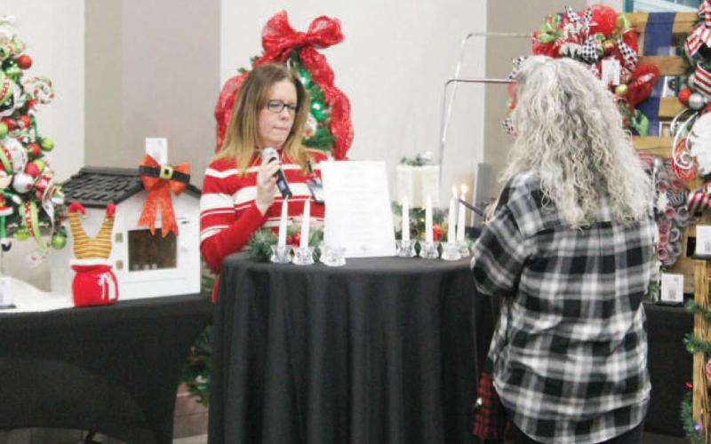 Titus Regional Medical Center’s annual “All is Bright” event was held Thursday evening. Holiday decor items, like trees, wreaths and stockings, were up for grabs in a silent auction. After bidding ended, a ceremony with music, prayer and a memorial candle lighting took place.