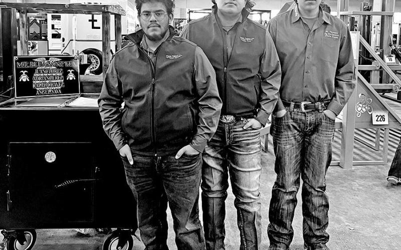 Angel Nava, Adrian Perez, and Ralph Chavez show their Rocket Oven-Grill
