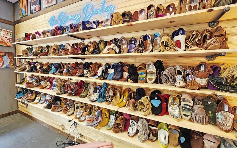 Handmade shoes line the walls of The Broncy Donkey TRIBUNE PHOTOS / NICOLE KIMBALL