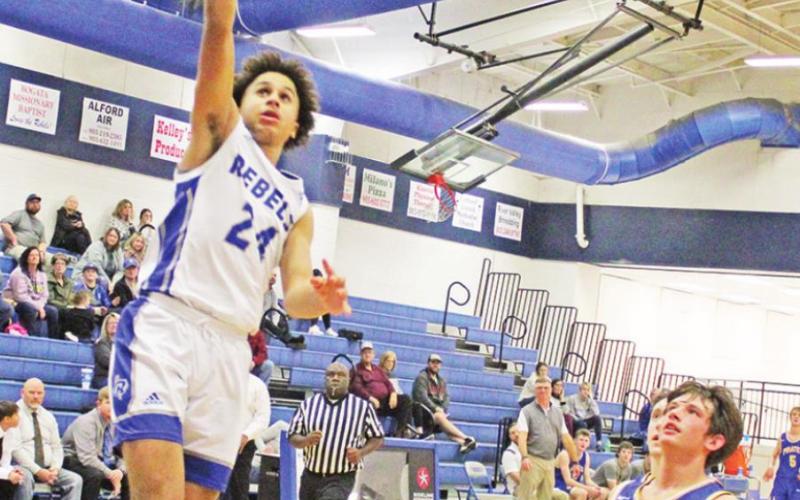 Rivercrest’s Kamryn WIlliams hits the skies for a layup during last week’s game against James Bowie. TRIBUNE PHOTO / QUINTEN BOYD