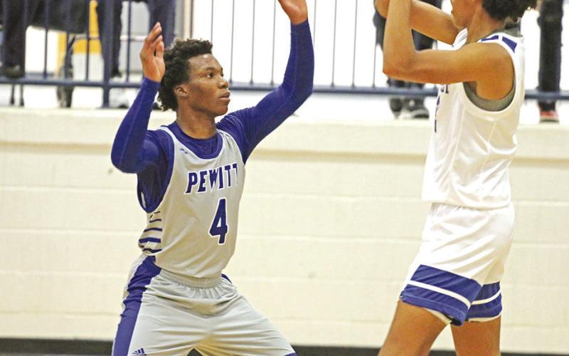 Pewitt’s Miyon Flemming guards Rivercrest’s Tre Williams during Friday’s game. The Rebels defeated the Brahmas, 6144. TRIBUNE PHOTO / QUINTEN BOYD
