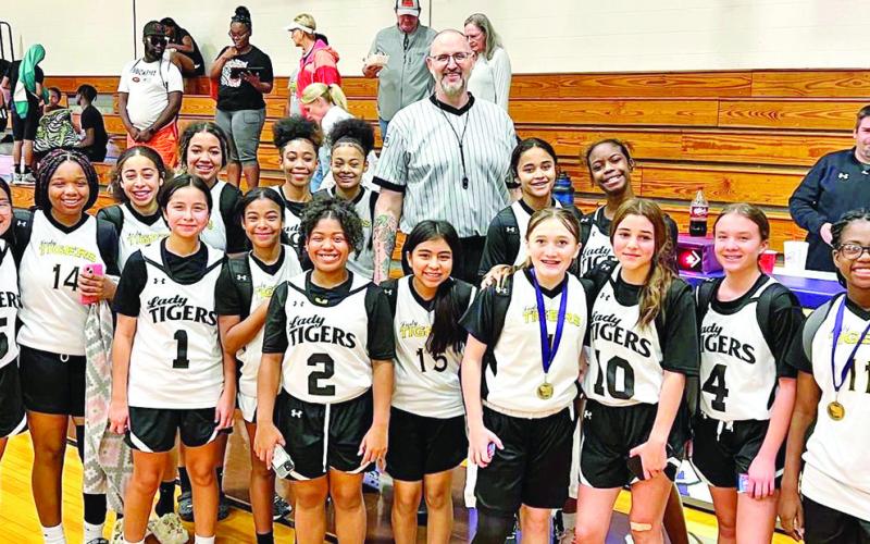 The MPJH 7th grade A team with former NBA Player, Greg Ostertag, of the Utah Jazz. COURTESY PHOTO